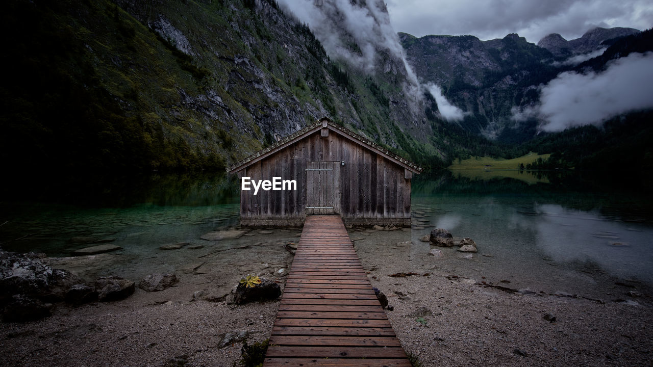 PIER AMIDST LAKE AGAINST SKY