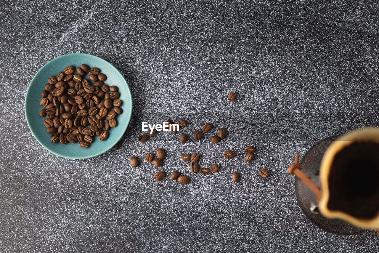 high angle view of roasted coffee beans on table