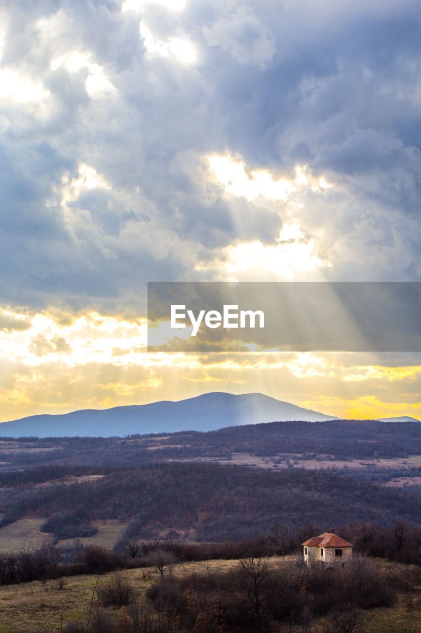 Scenic view of mountains against sky during sunset