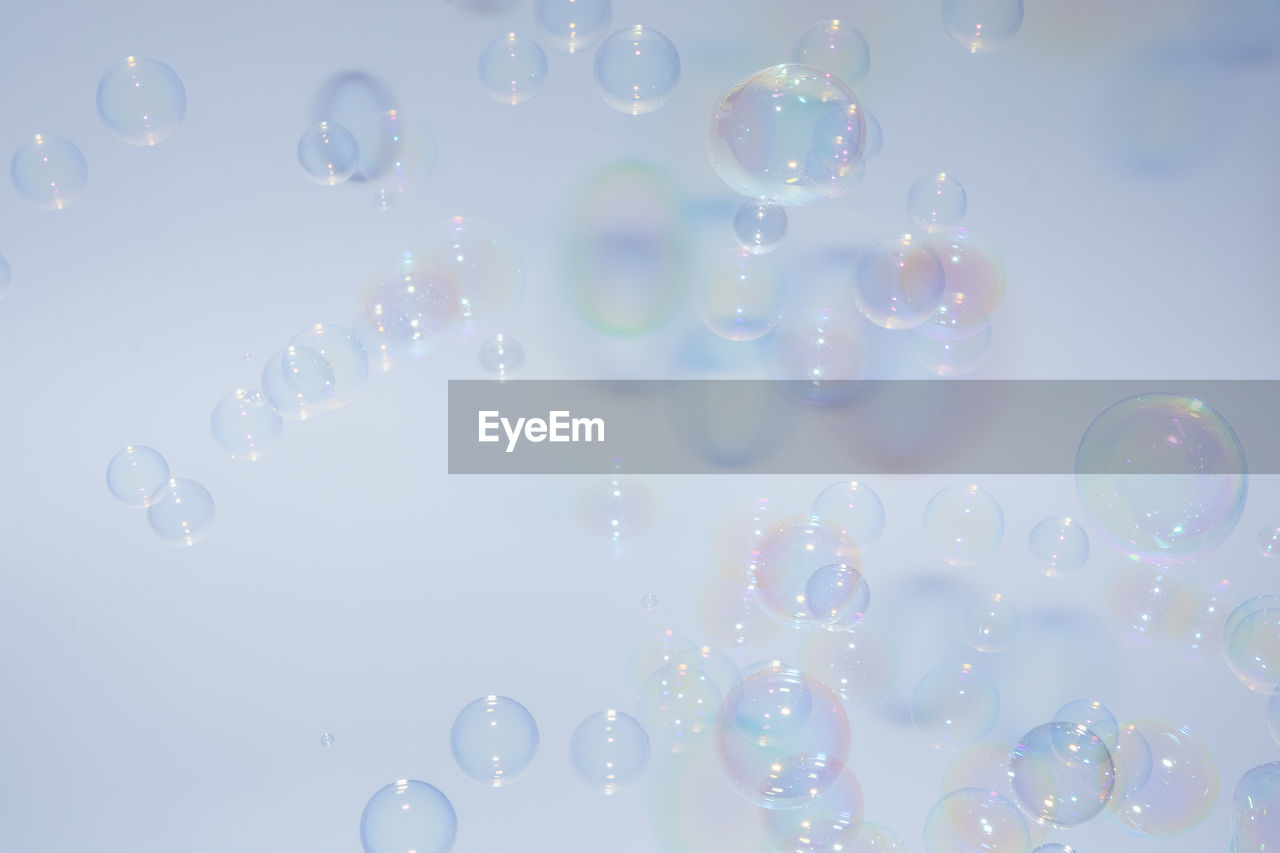 Close-up of bubbles against white background