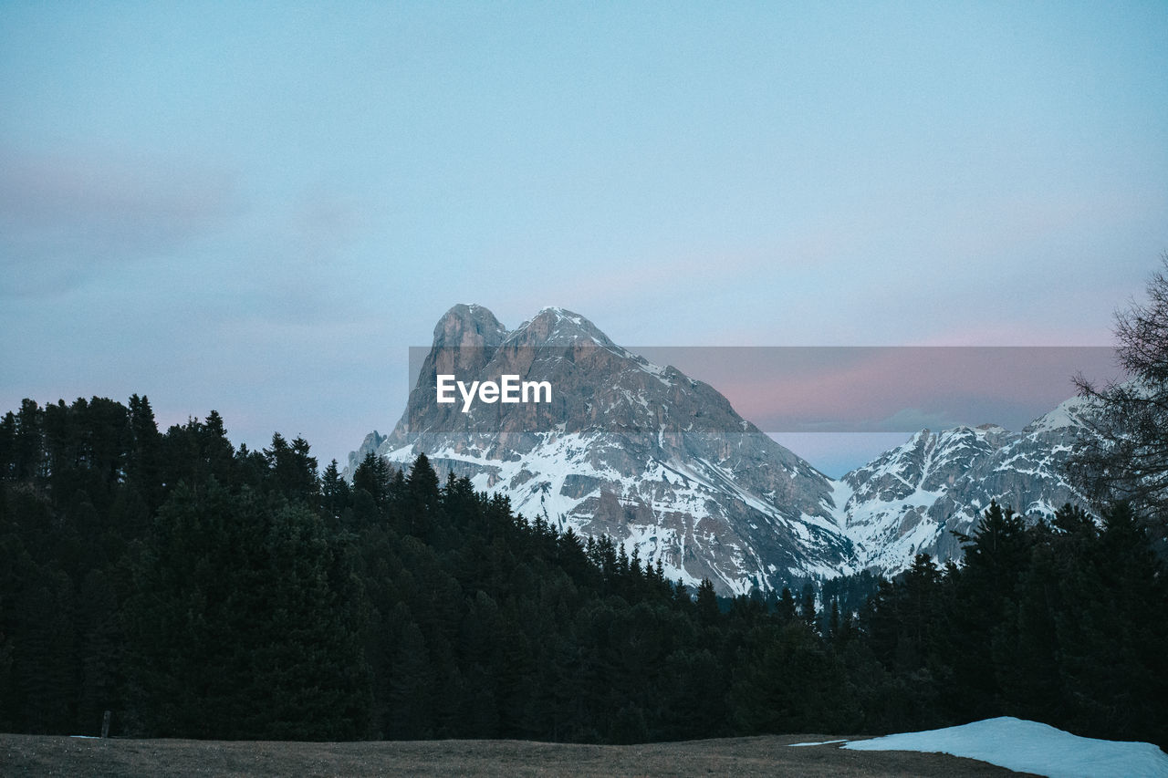 Scenic view of snowcapped mountains against sky during winter