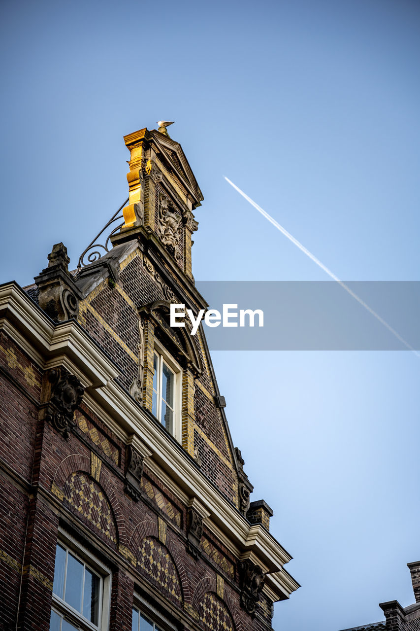 low angle view of building against blue sky