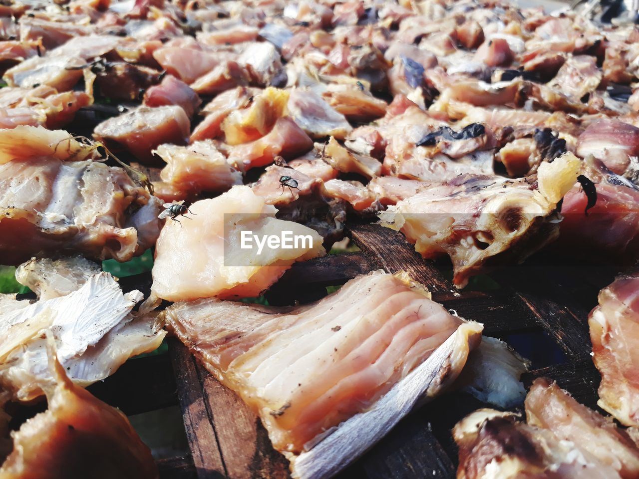 HIGH ANGLE VIEW OF CHICKEN ON BARBECUE