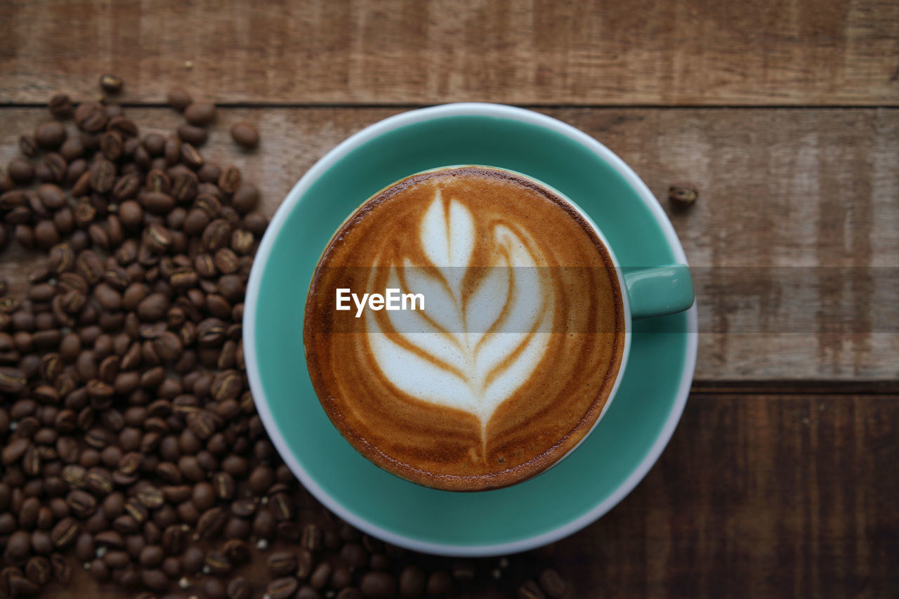 DIRECTLY ABOVE SHOT OF CAPPUCCINO WITH COFFEE CUP