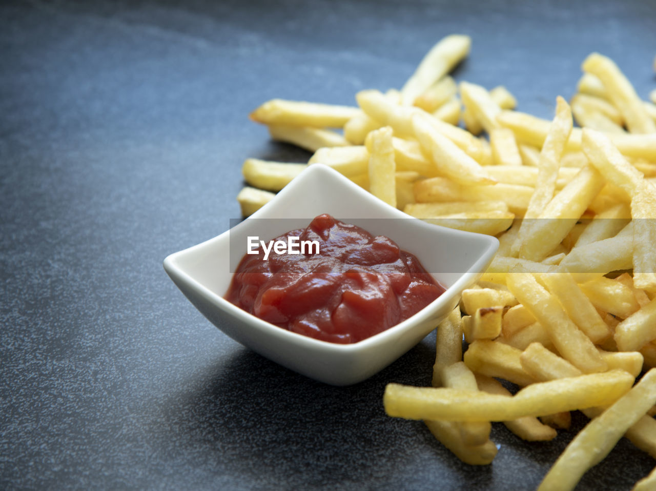 CLOSE-UP OF PASTA WITH FRIES AND SALAD