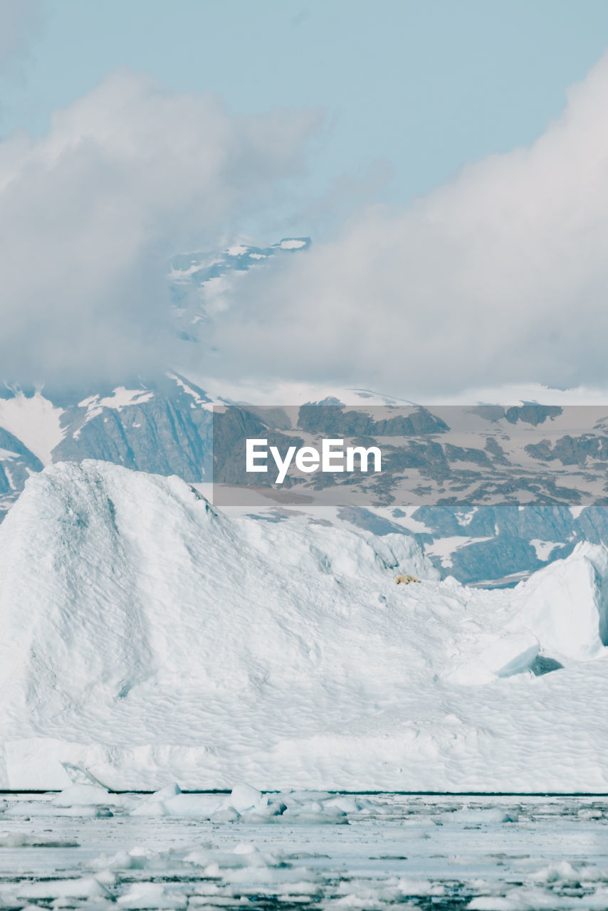 snow covered mountains against sky