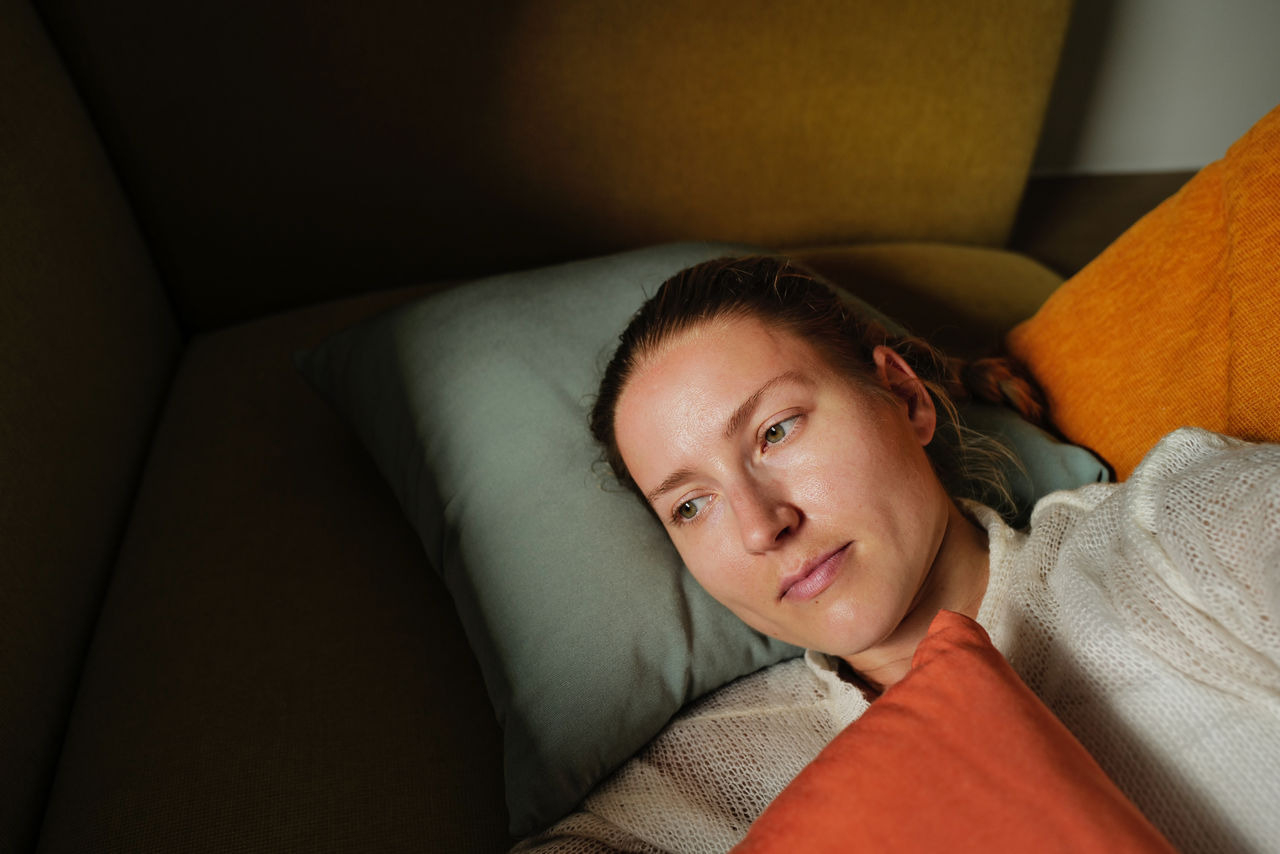 Woman relaxing on the colorful pillows