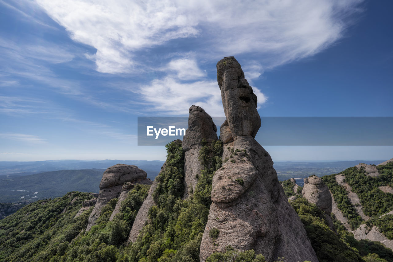 SCENIC VIEW OF ROCK FORMATION ON LAND AGAINST SKY