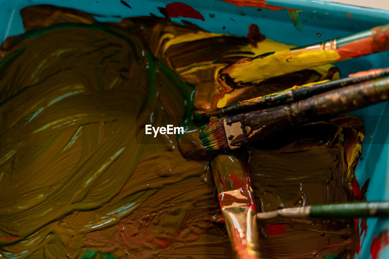 Close up shot of kids doing painting