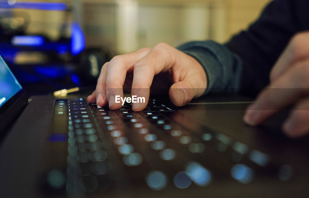 Close up of a hands of a businessman on a keyboard. 