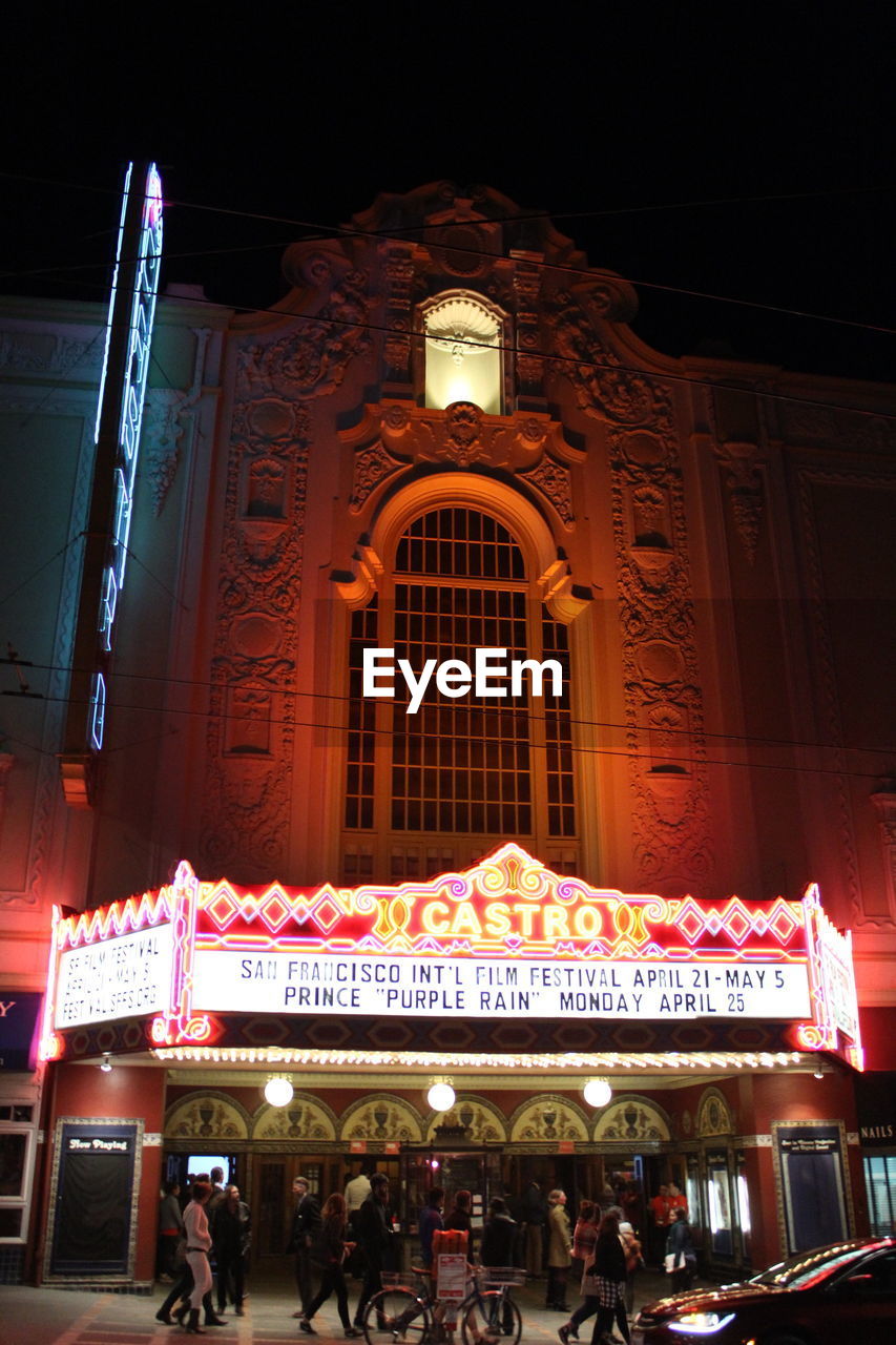 VIEW OF ILLUMINATED BUILDING AT NIGHT