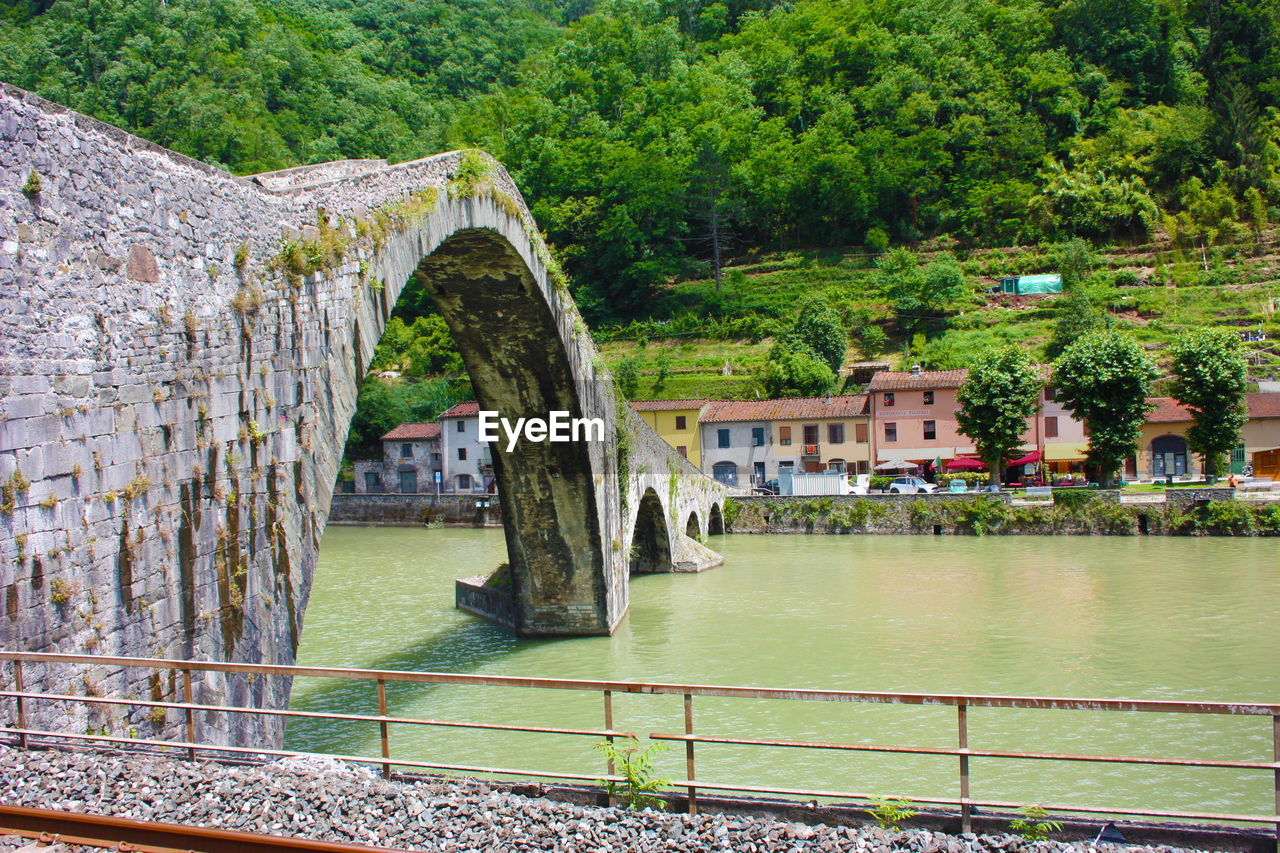 The devil's bridge in the tuscan town of borgo a mozzano on the serchio river between the hills 