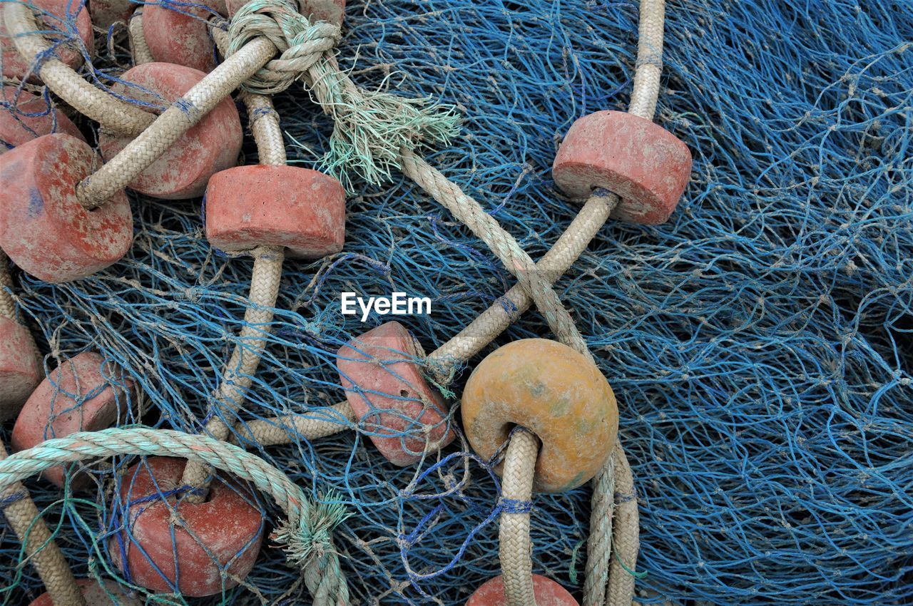 Close-up of fishing net at harbor