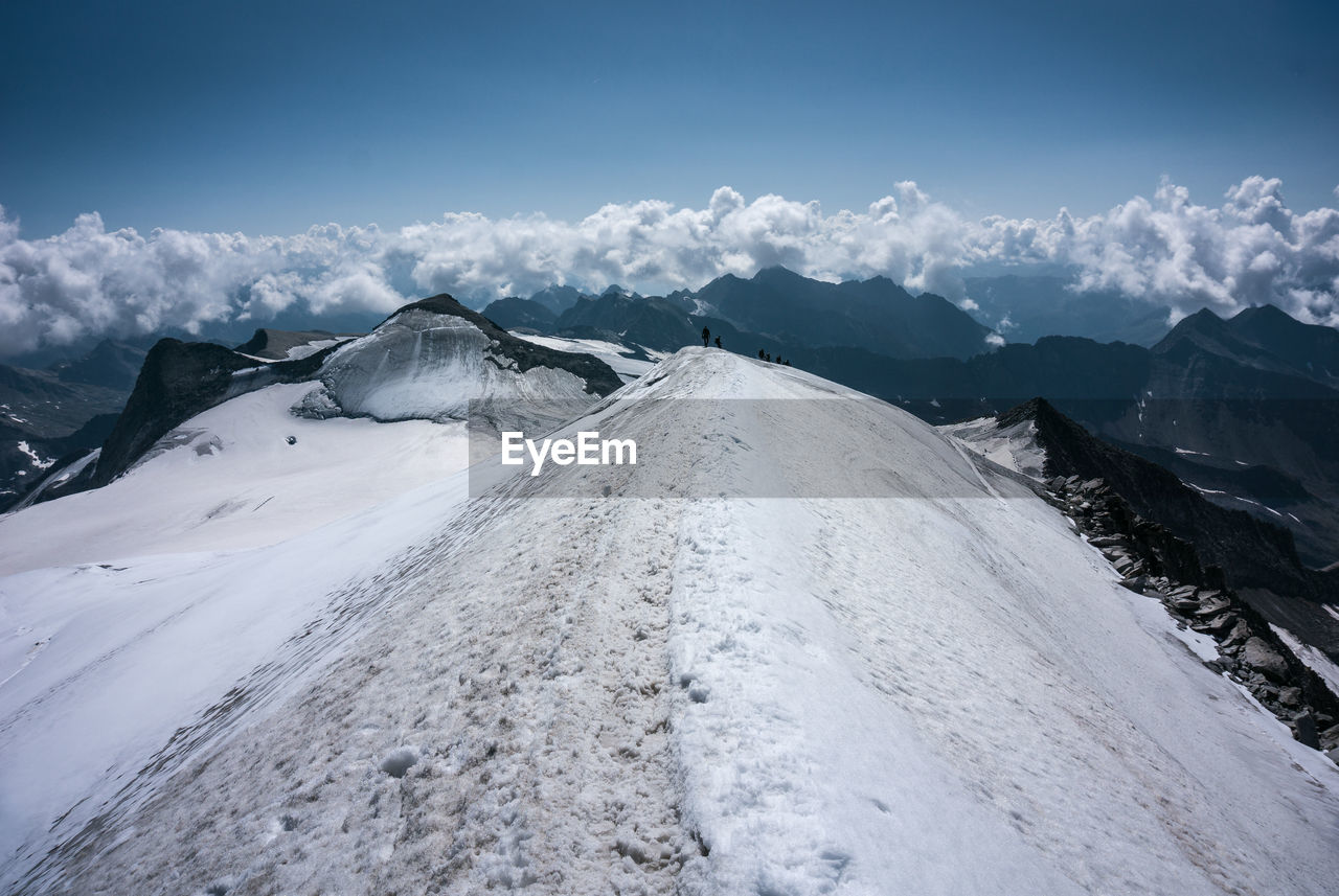 Snow covered mountains against sky