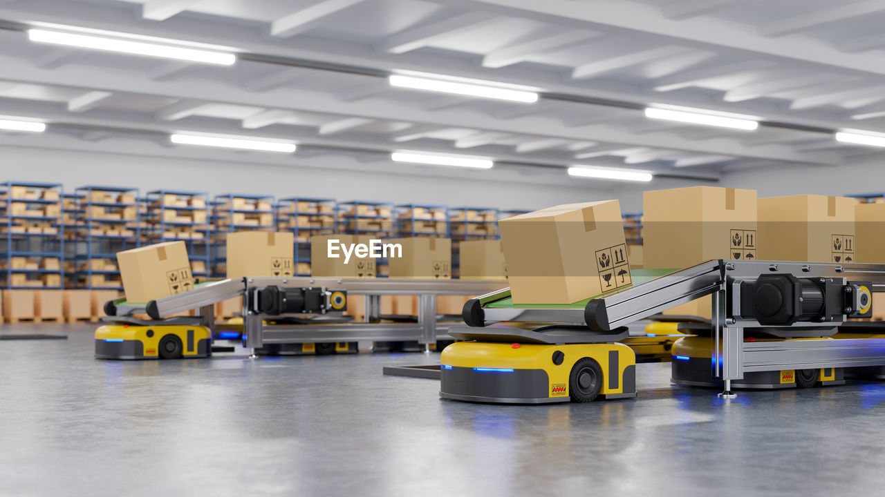 Boxes on conveyor belt in warehouse