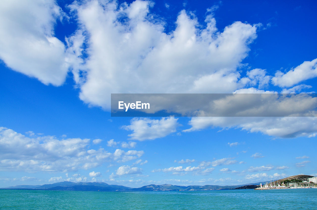 Scenic view of sea against blue sky