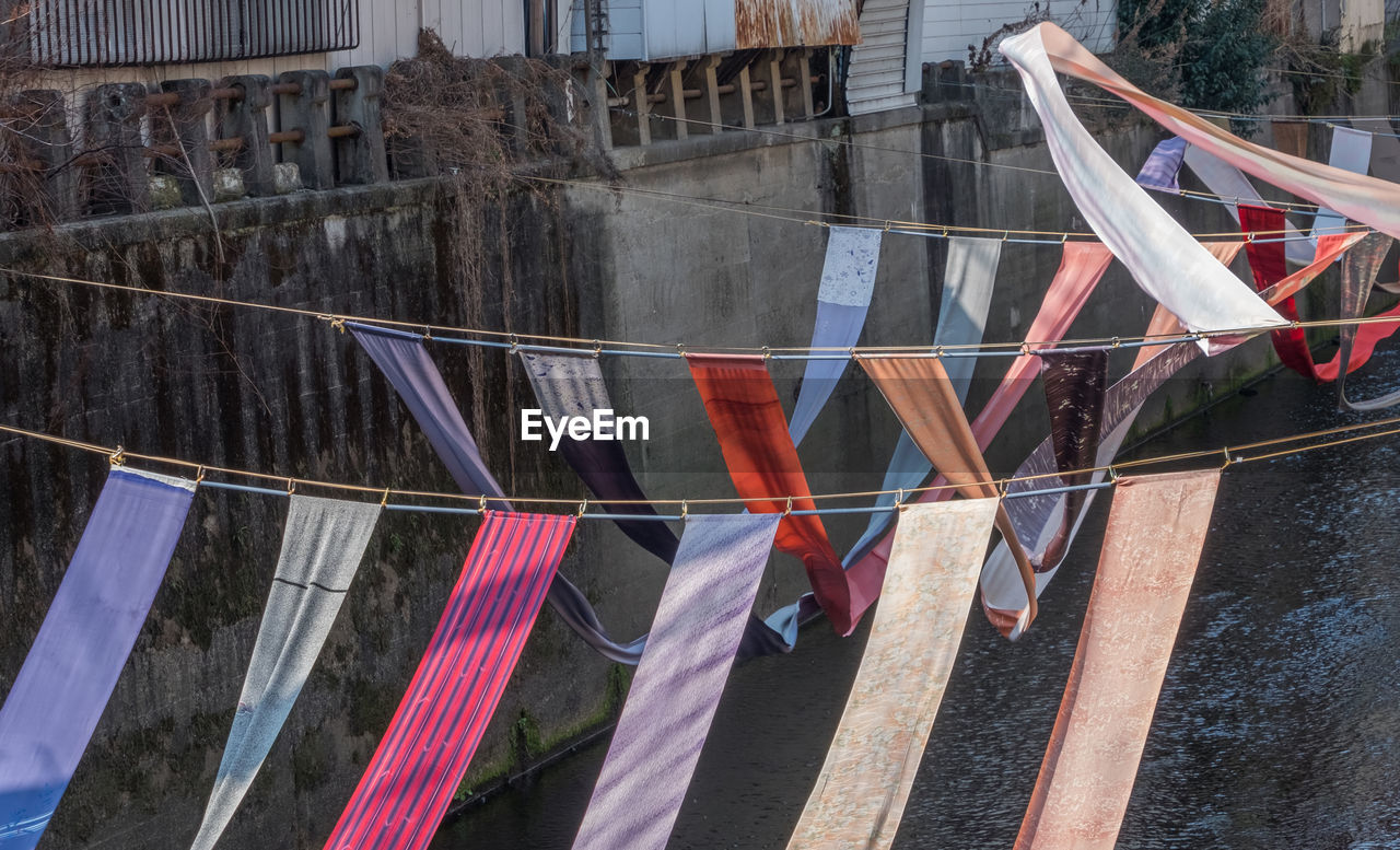 CLOTHES DRYING AGAINST BUILDINGS