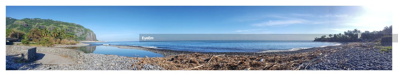 PANORAMIC SHOT OF SEA AGAINST BLUE SKY