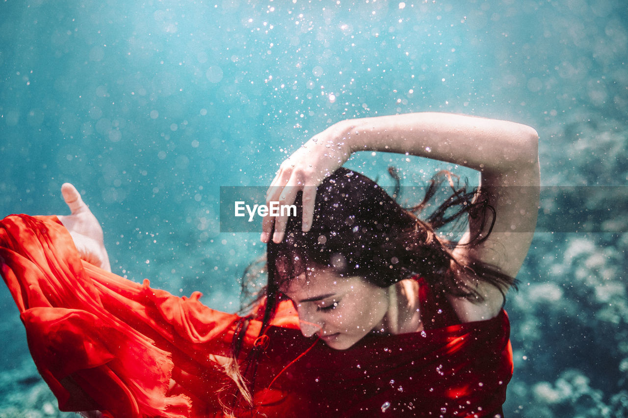 PORTRAIT OF A YOUNG WOMAN IN RAIN