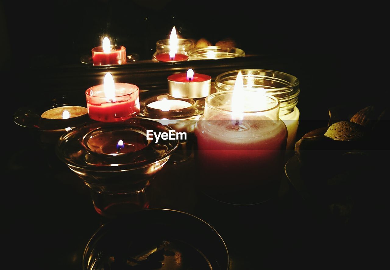 Close-up of candles in darkroom