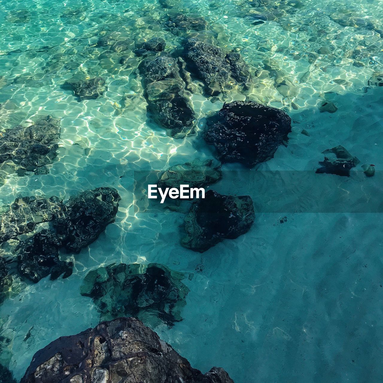 HIGH ANGLE VIEW OF SEA AND BLUE WATER