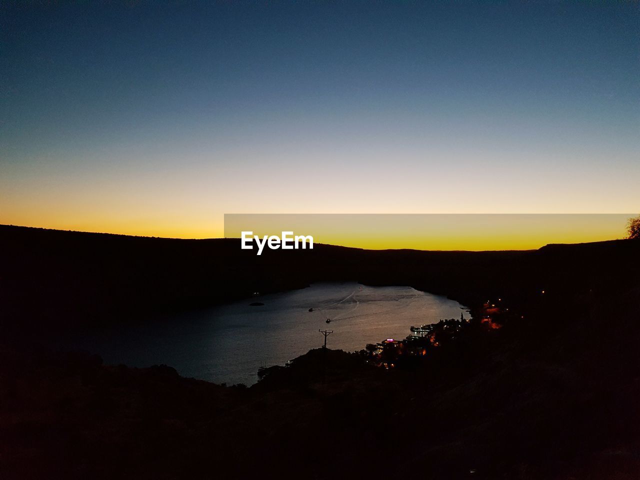 SCENIC VIEW OF MOUNTAINS AT SUNSET