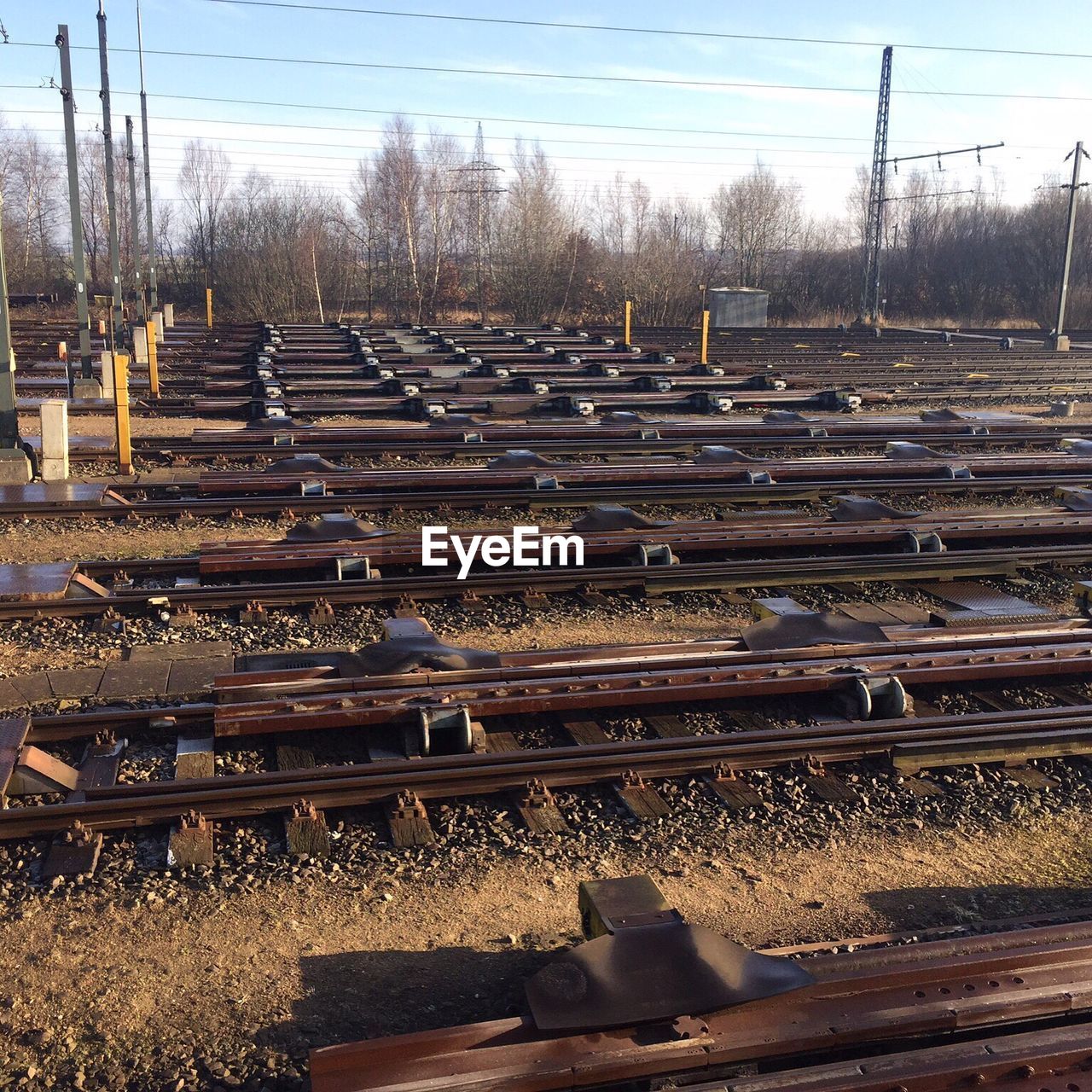 Row of railroad tracks against sky
