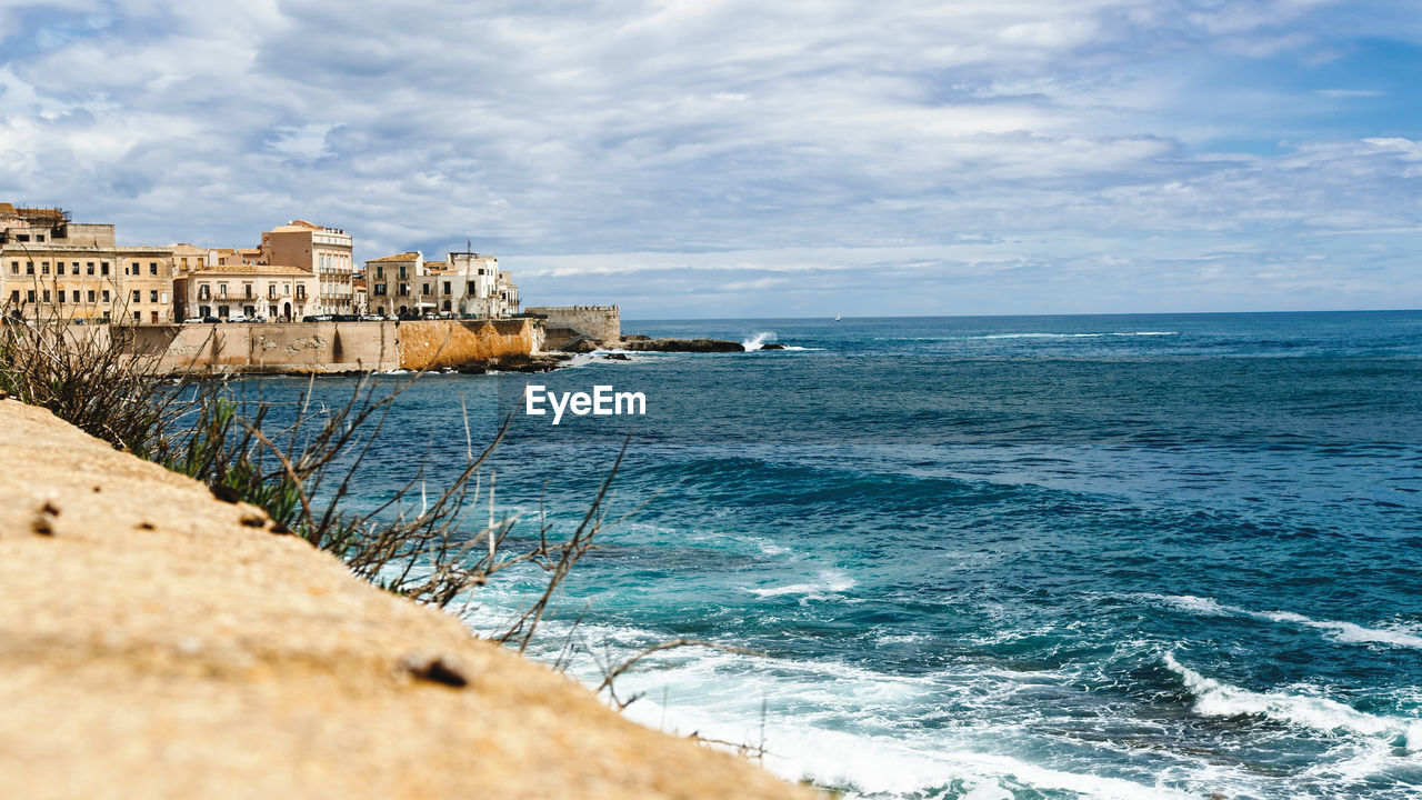 View of syracusa ortigia island on the ocean in spring season