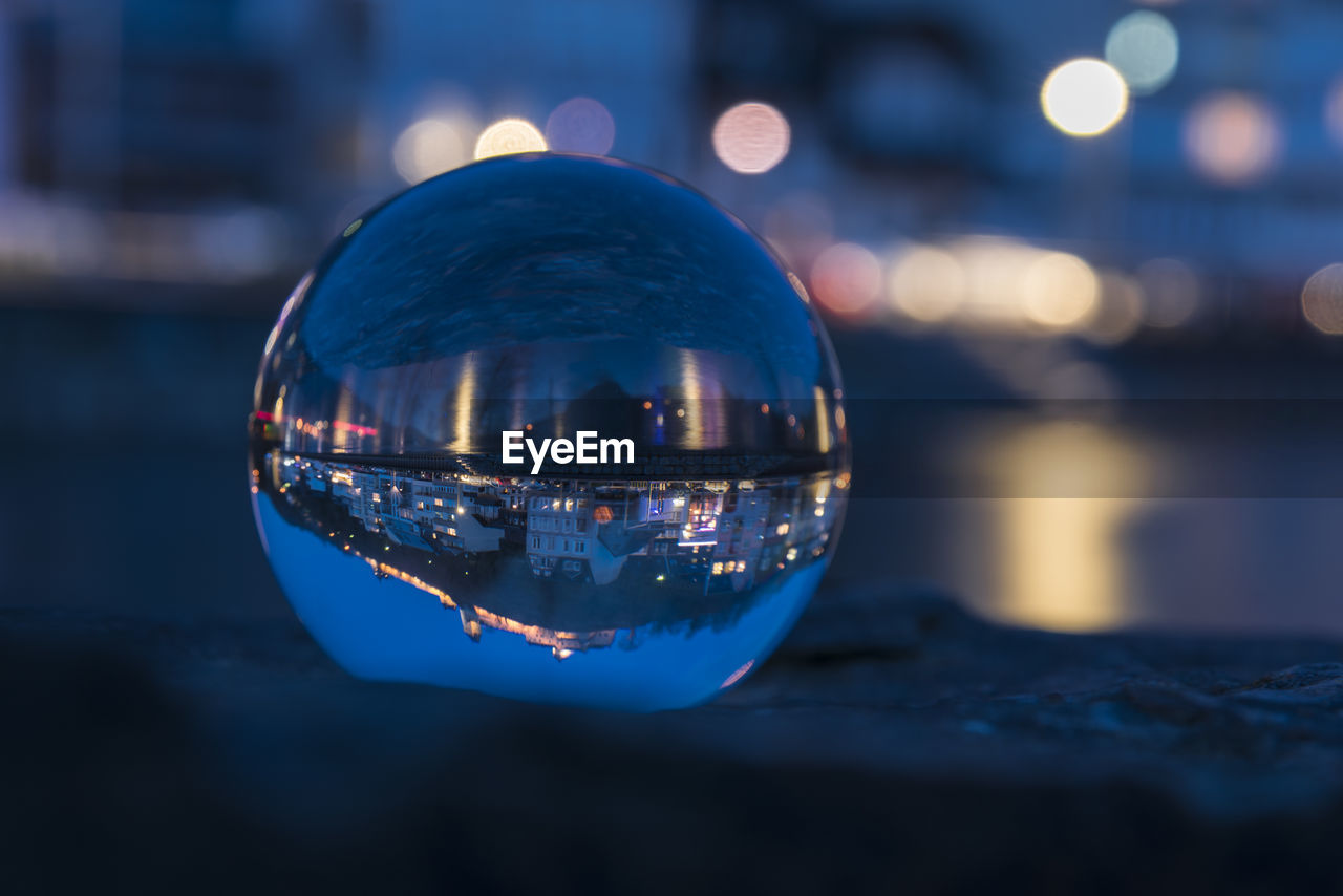 Close-up of crystal ball in water at night