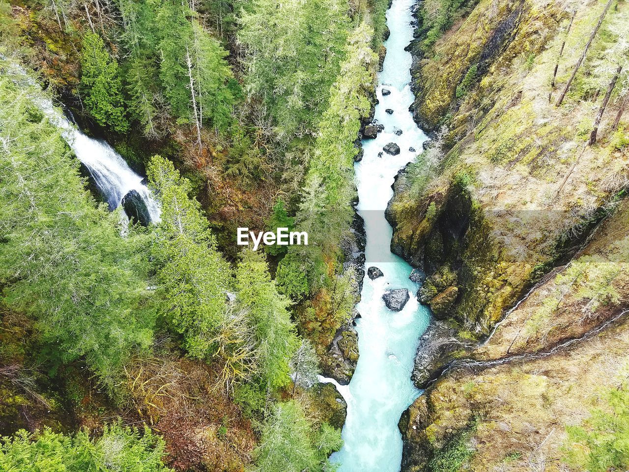 HIGH ANGLE VIEW OF WATERFALL IN RIVER