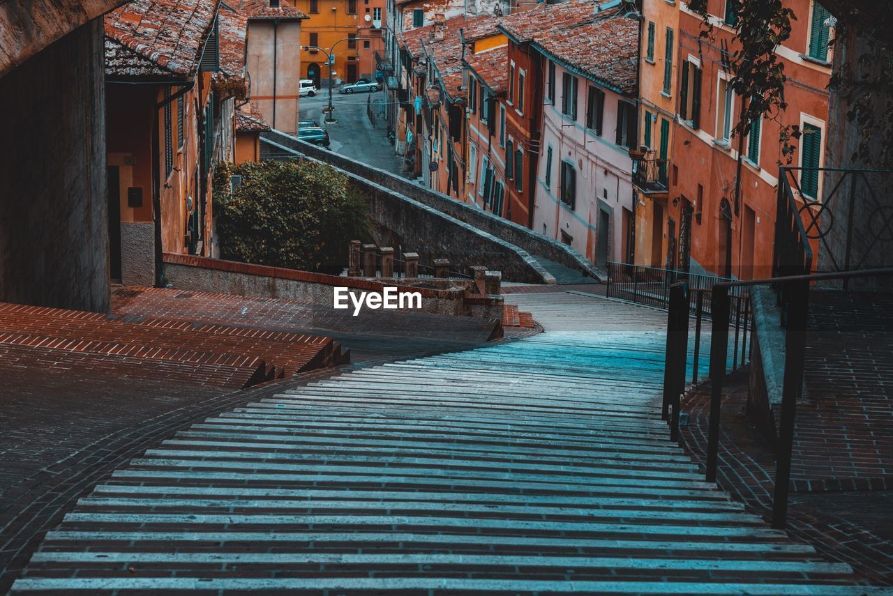 Empty alley amidst buildings in town