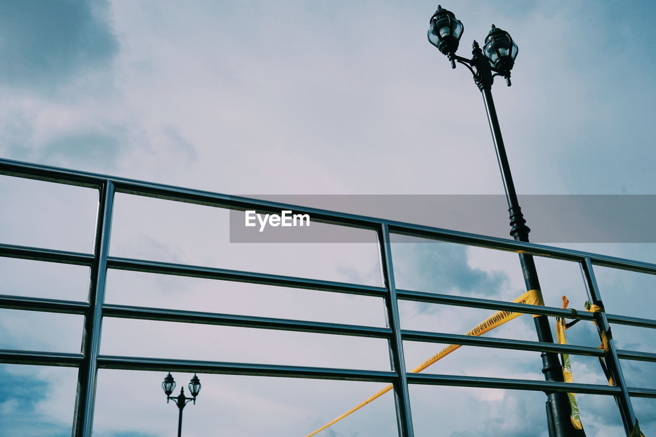 Low angle view of street light against sky