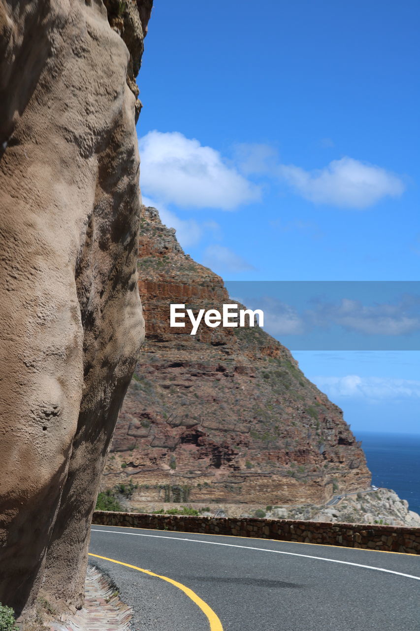 Scenic view of shapmans peak drive against sky - cape town