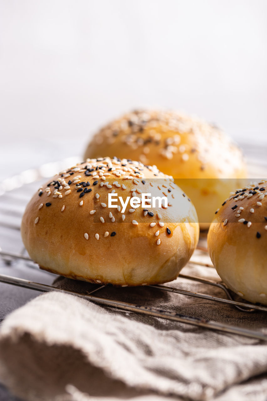 Freshly baked burger buns on a table