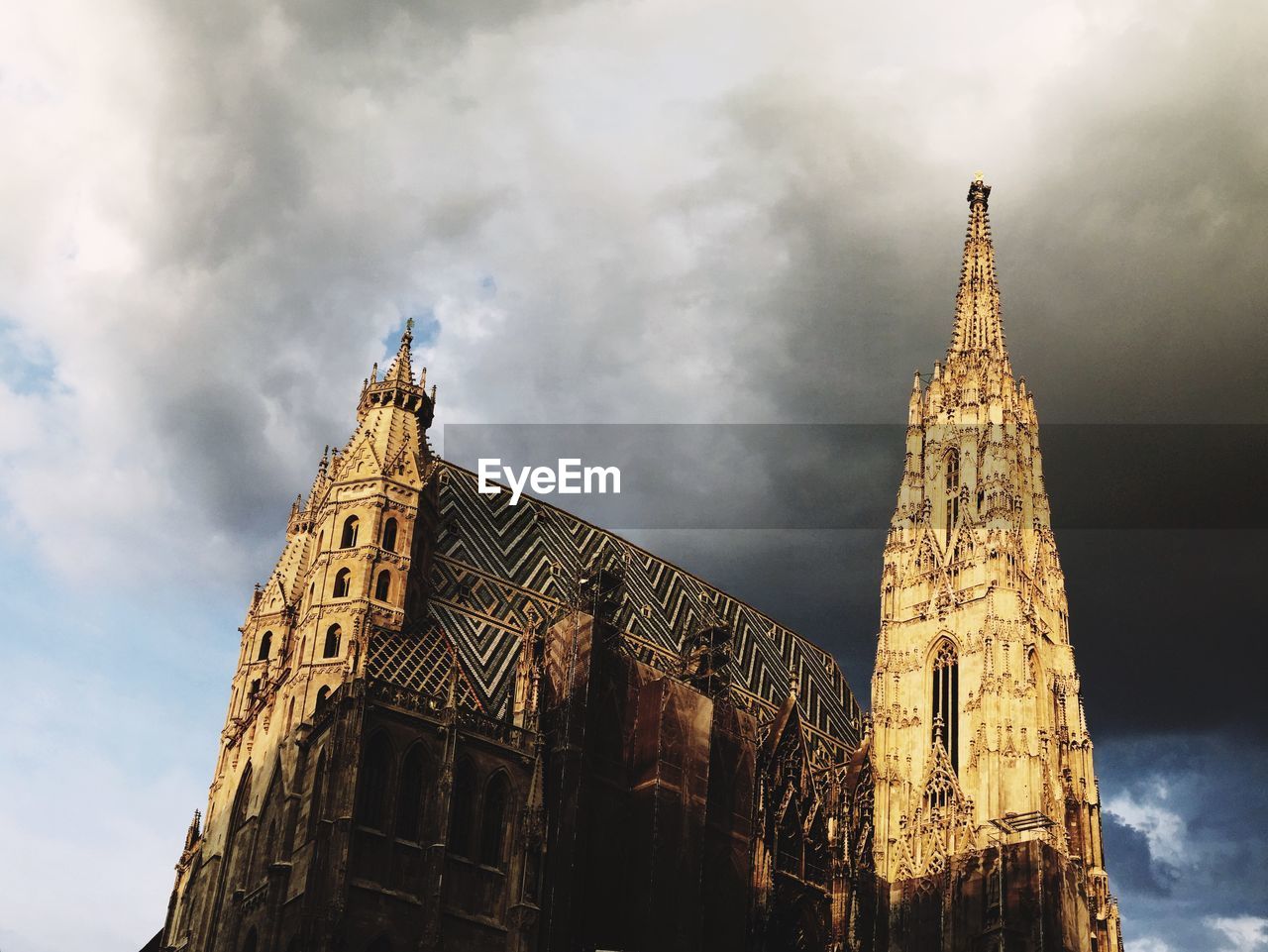 Low angle view of st stephen cathedral against cloudy sky