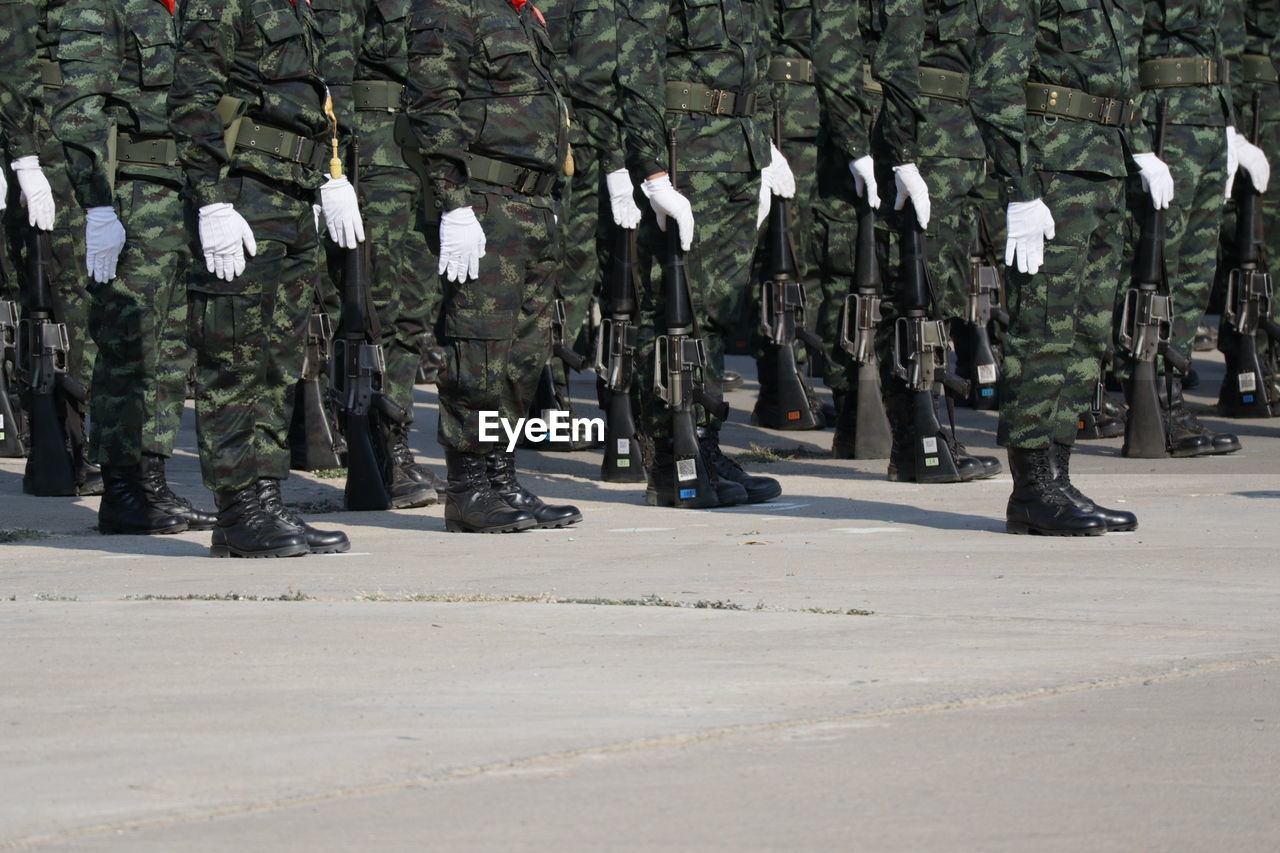 Low section of soldiers standing on street