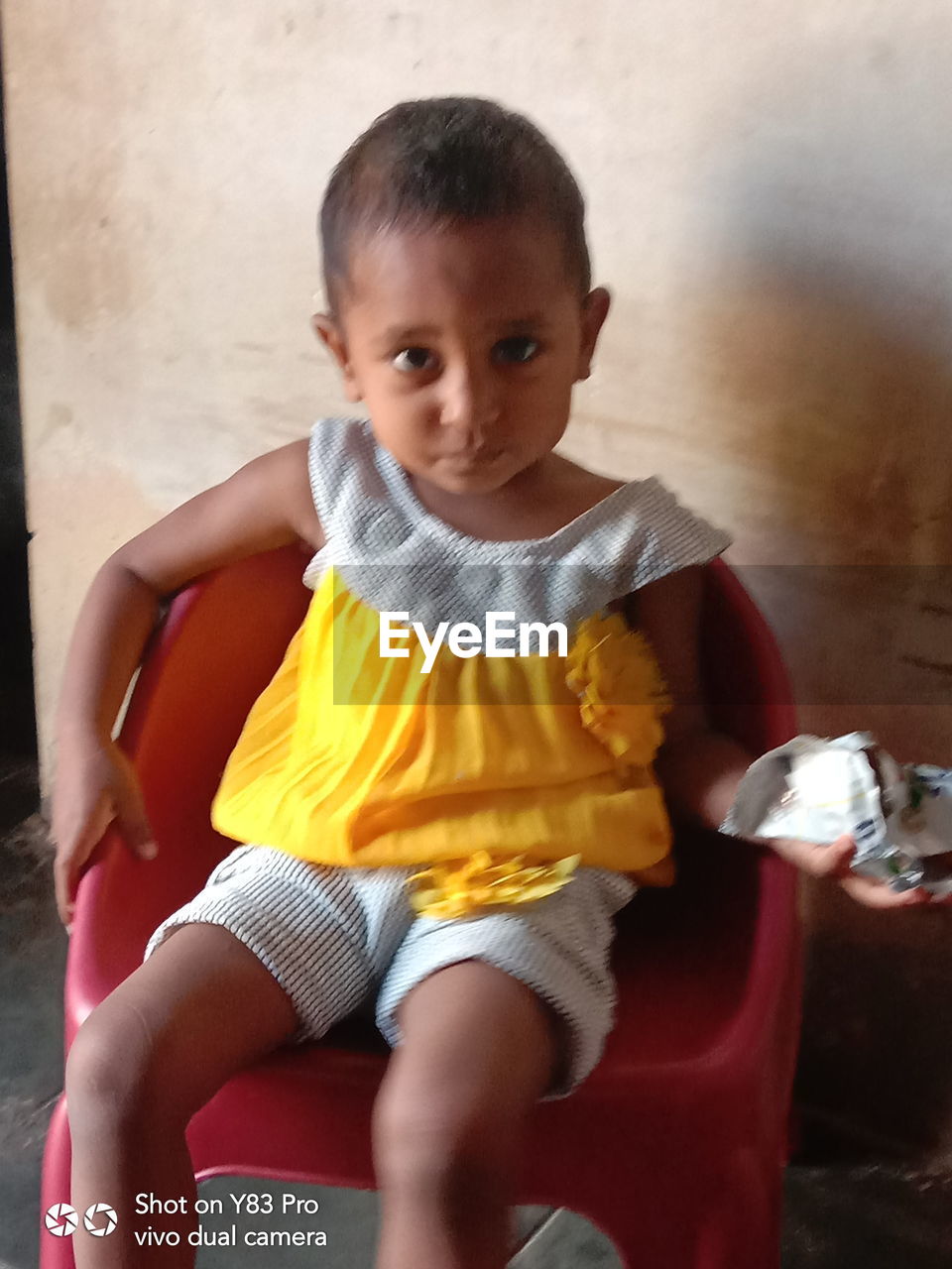 FULL LENGTH PORTRAIT OF CUTE BOY PLAYING WITH BABY