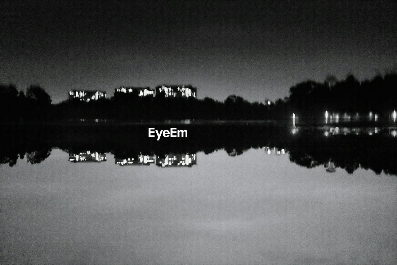 REFLECTION OF TREES IN WATER