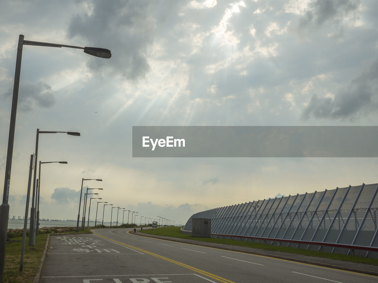 ROAD BY STREET AGAINST SKY