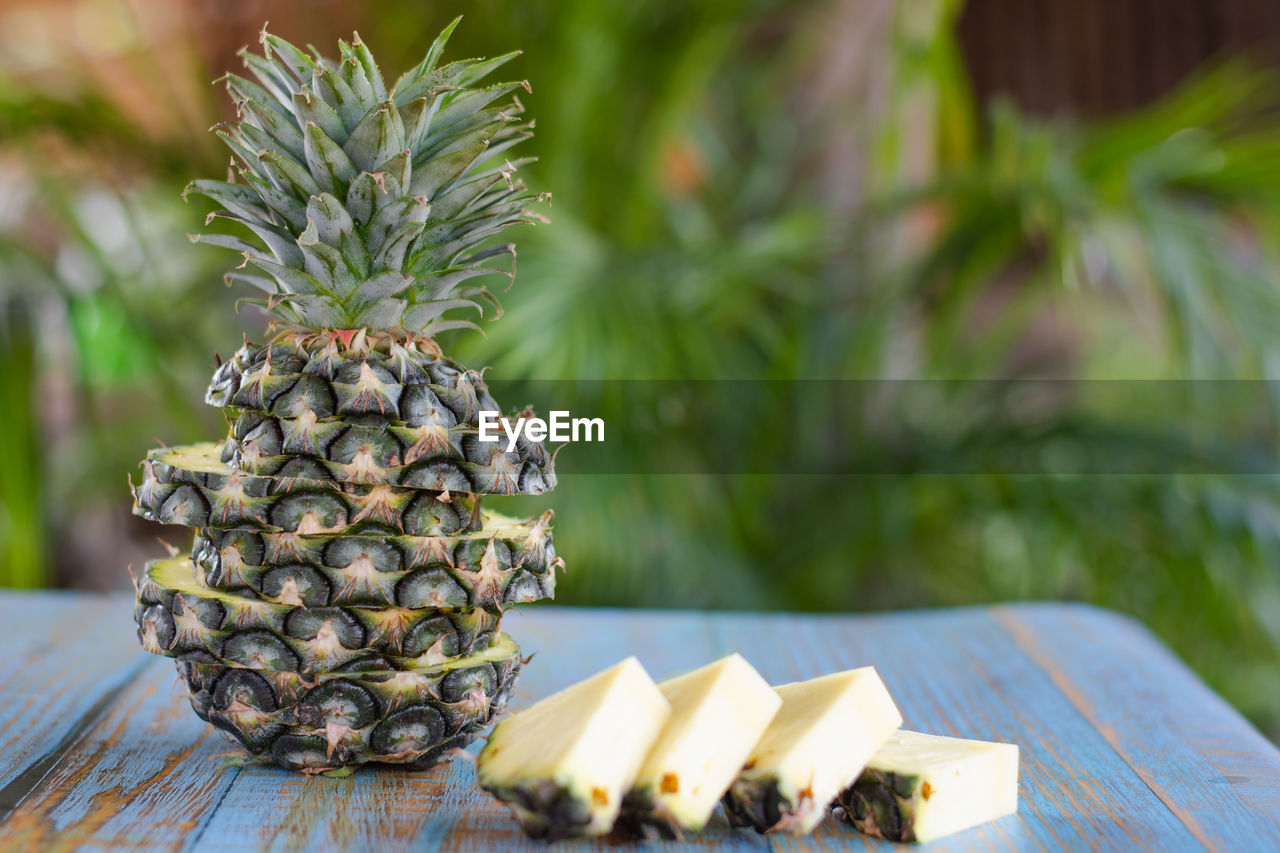 Pineapple slices  on wooden table 