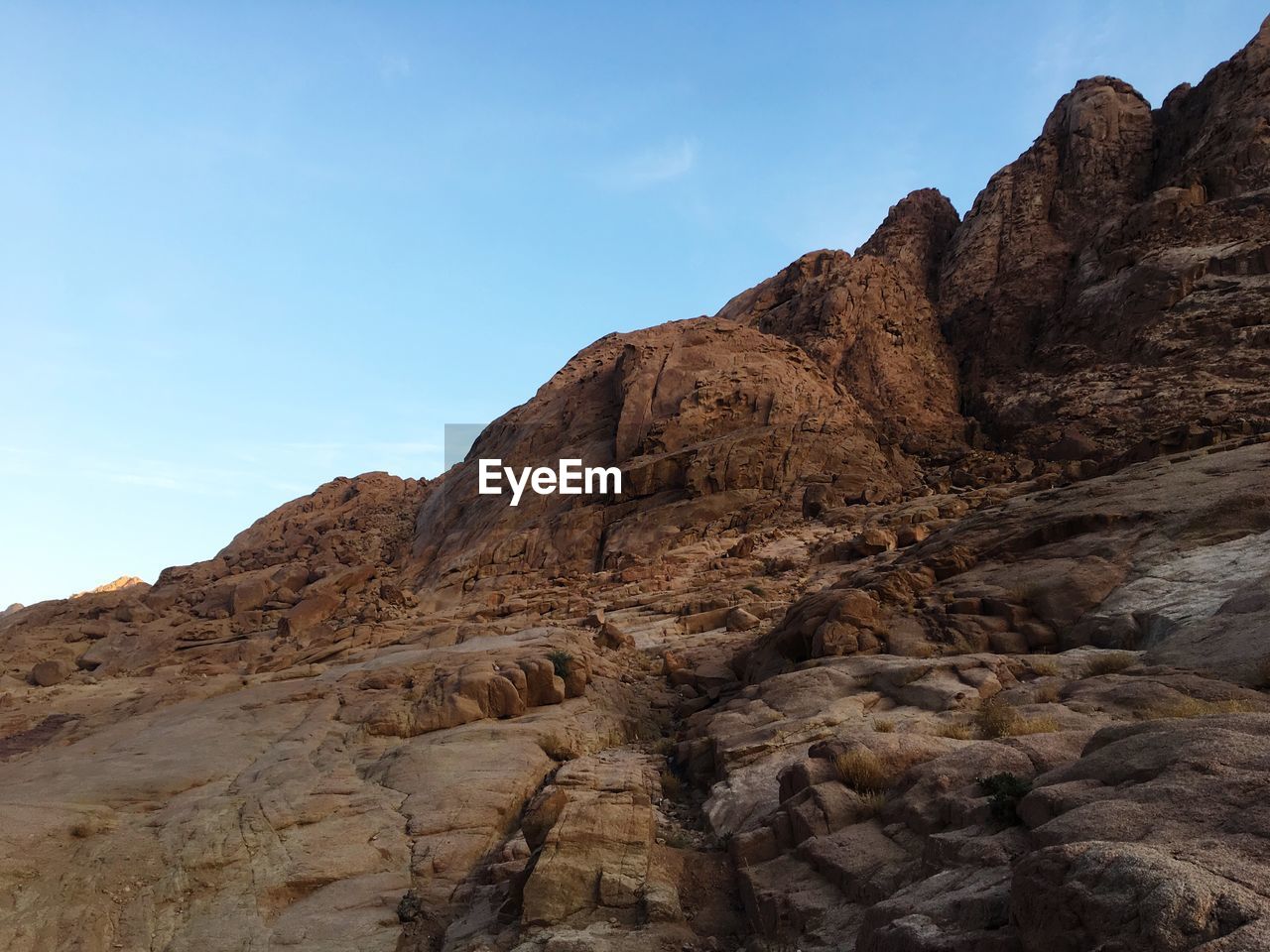 Low angle view of rock formations against sky