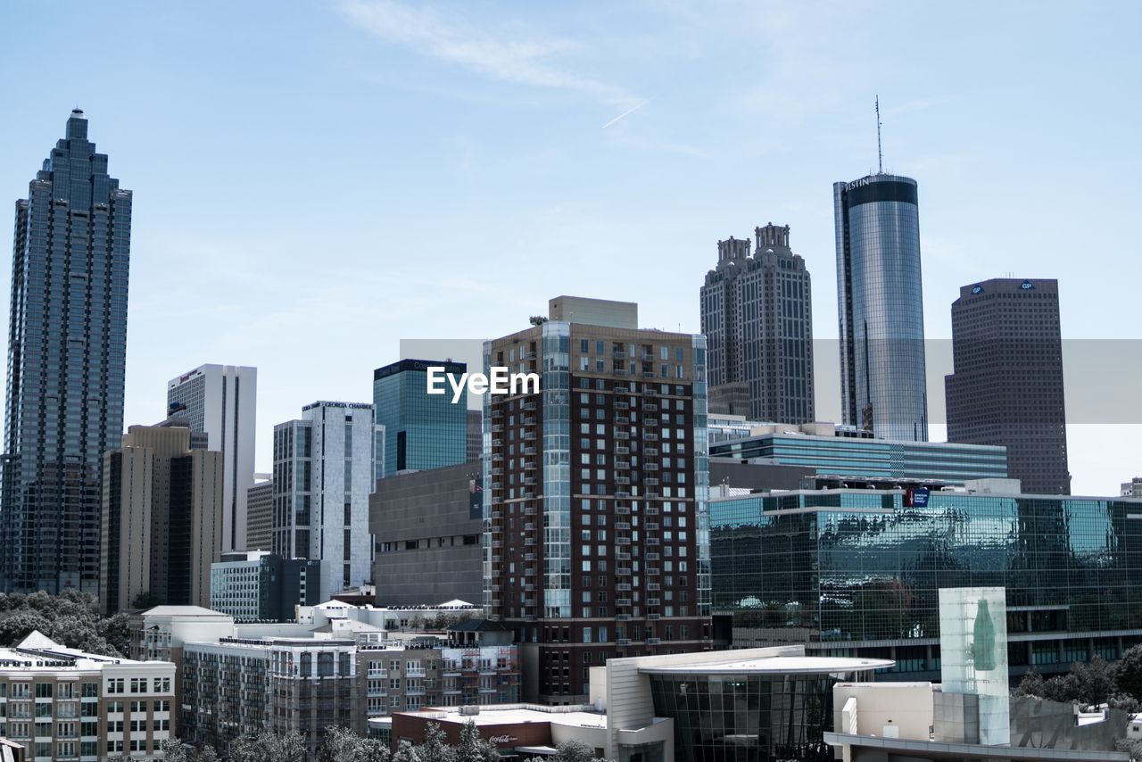 Modern buildings in city against sky