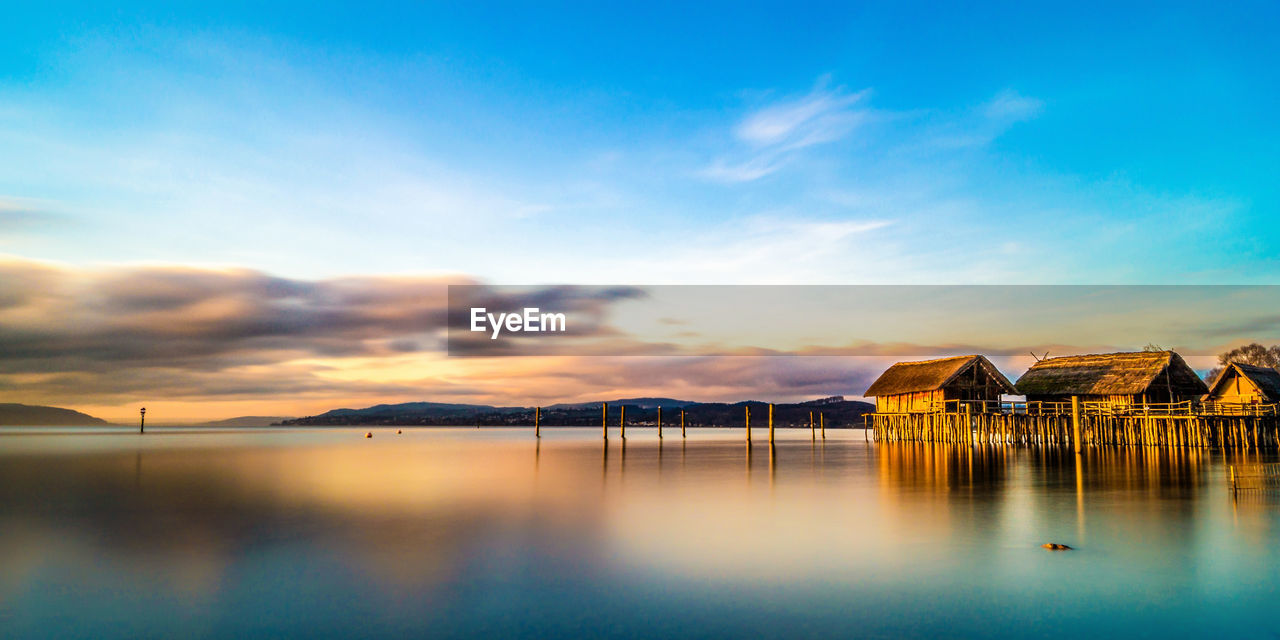 SCENIC VIEW OF SEA AGAINST ORANGE SKY