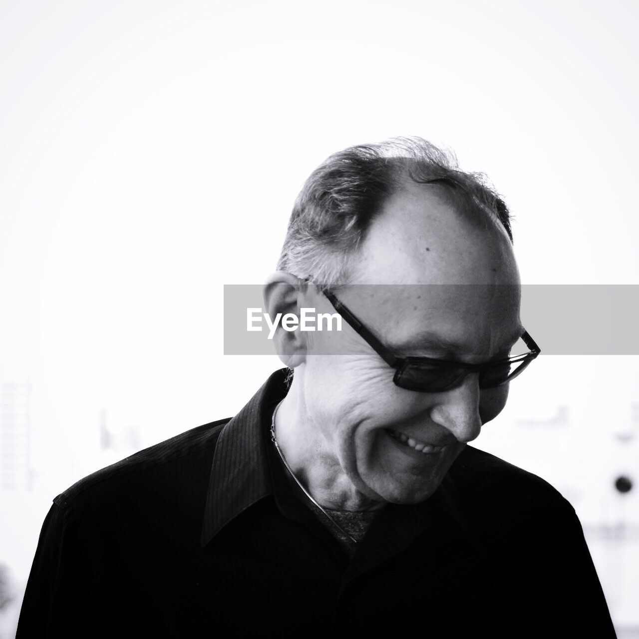 Smiling mature man against clear sky