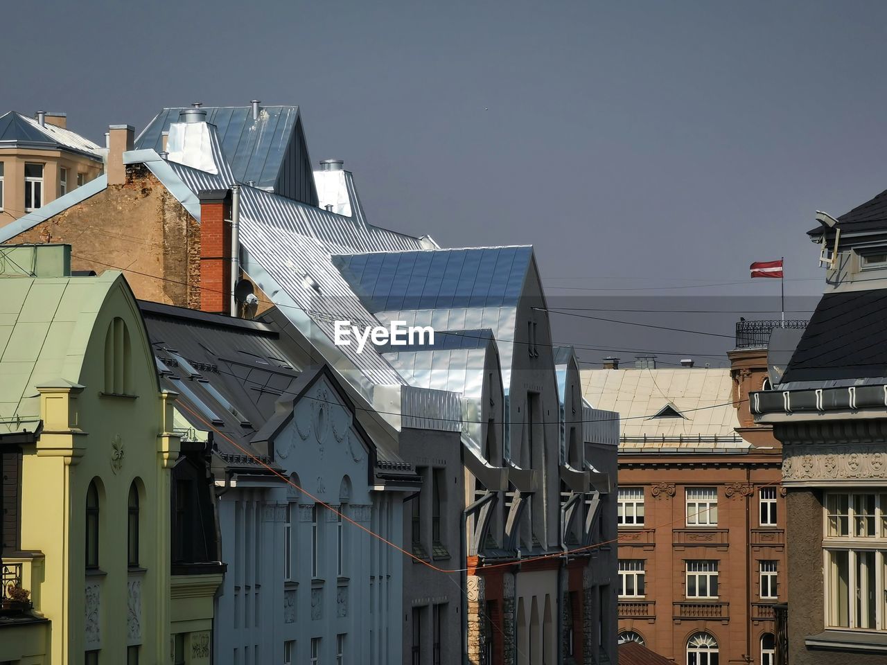 Low angle view of buildings in city against clear sky