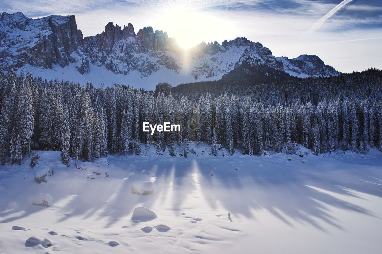 Scenic view of snow covered mountains against sky