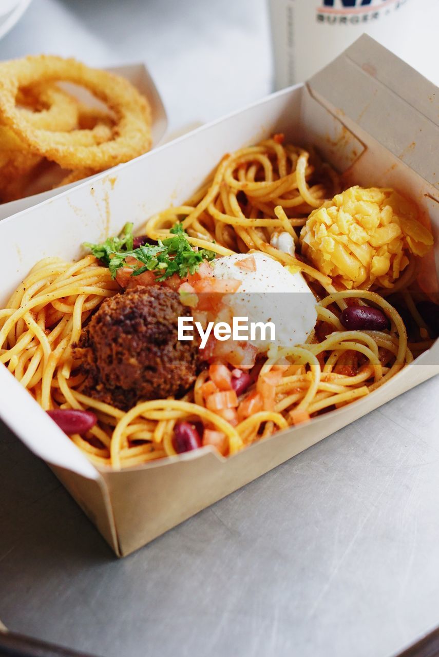 Close-up of noodles in box on table