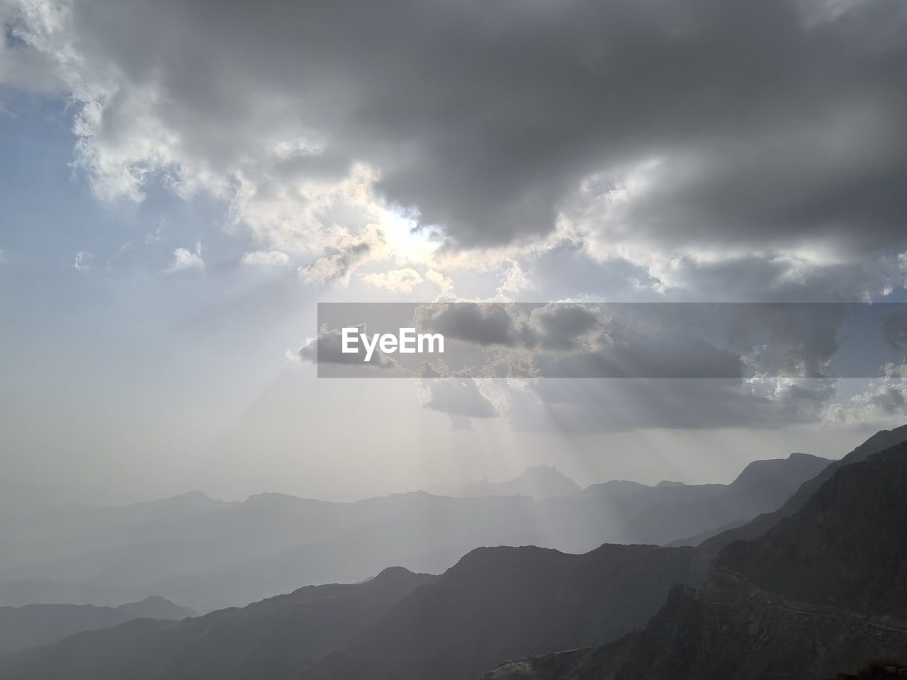 cloud, mountain, sky, environment, scenics - nature, beauty in nature, landscape, mountain range, nature, fog, sunlight, sunbeam, horizon, dramatic sky, tranquility, travel, no people, outdoors, cloudscape, morning, land, travel destinations, tranquil scene, overcast, mountain peak, silhouette, awe, sun, tourism, atmospheric mood, storm, idyllic, back lit, dawn, non-urban scene, day