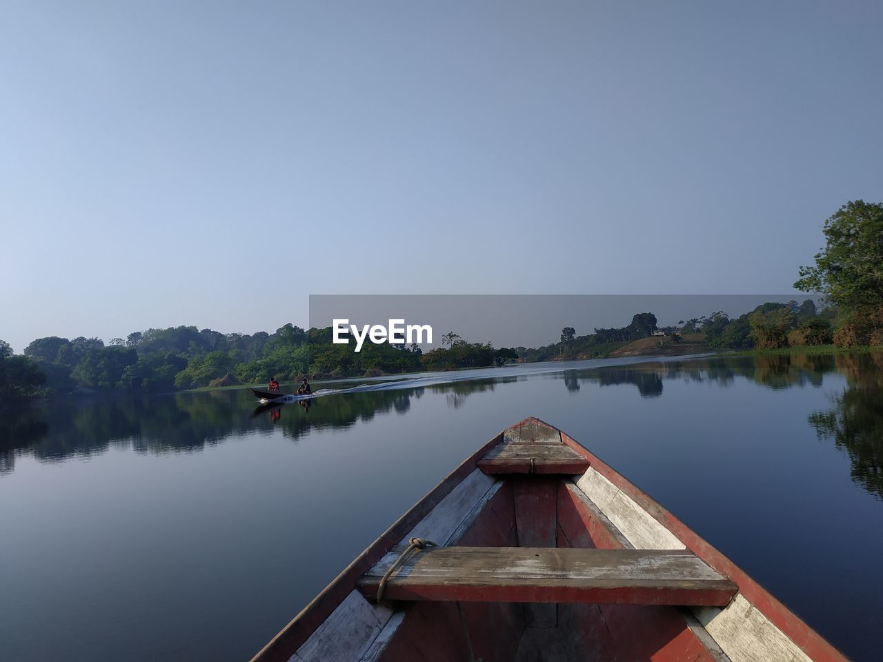 PIER ON LAKE AGAINST CLEAR SKY