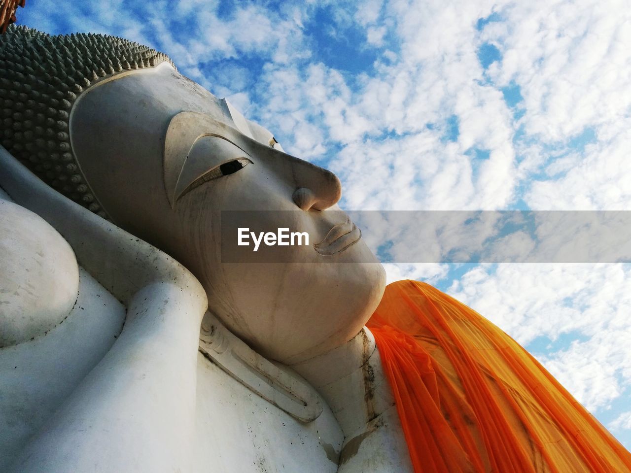 Low angle view of statue against cloudy sky